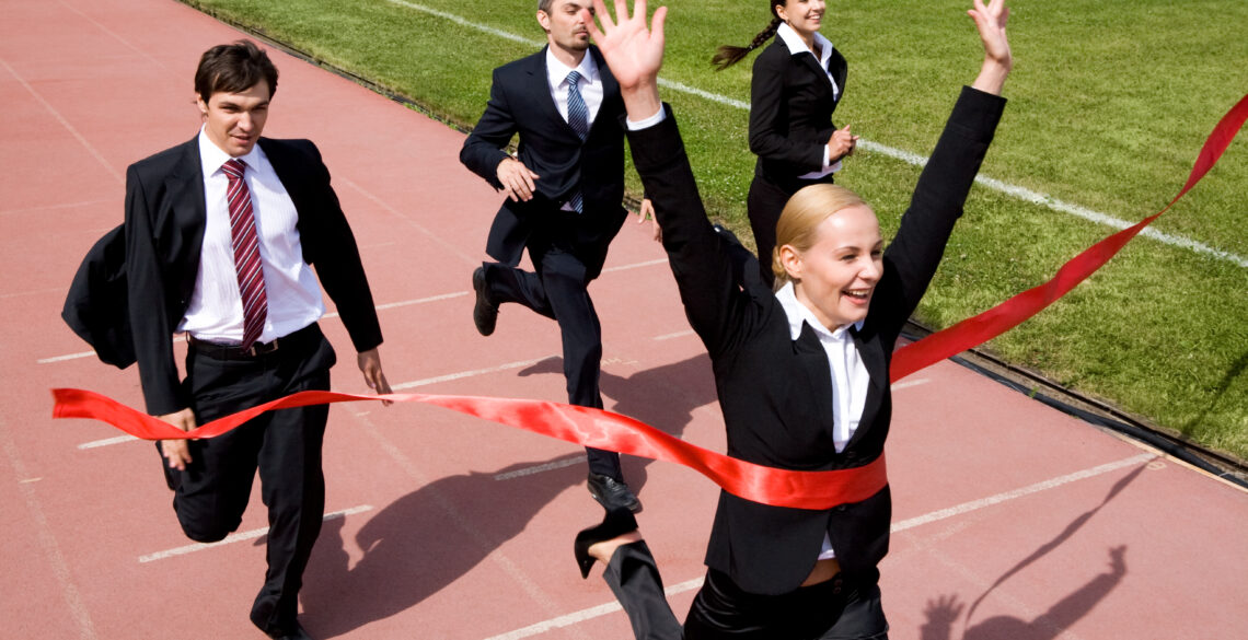 A woman won the race crossing the red ribbon first