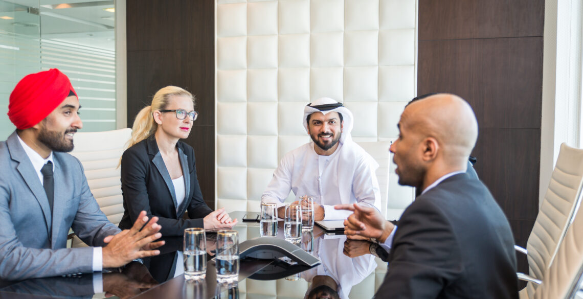 Group of people talking about business