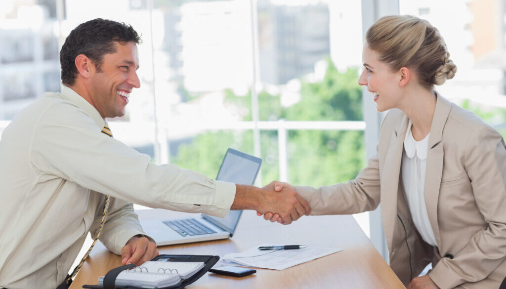 A man and a woman shaking hands