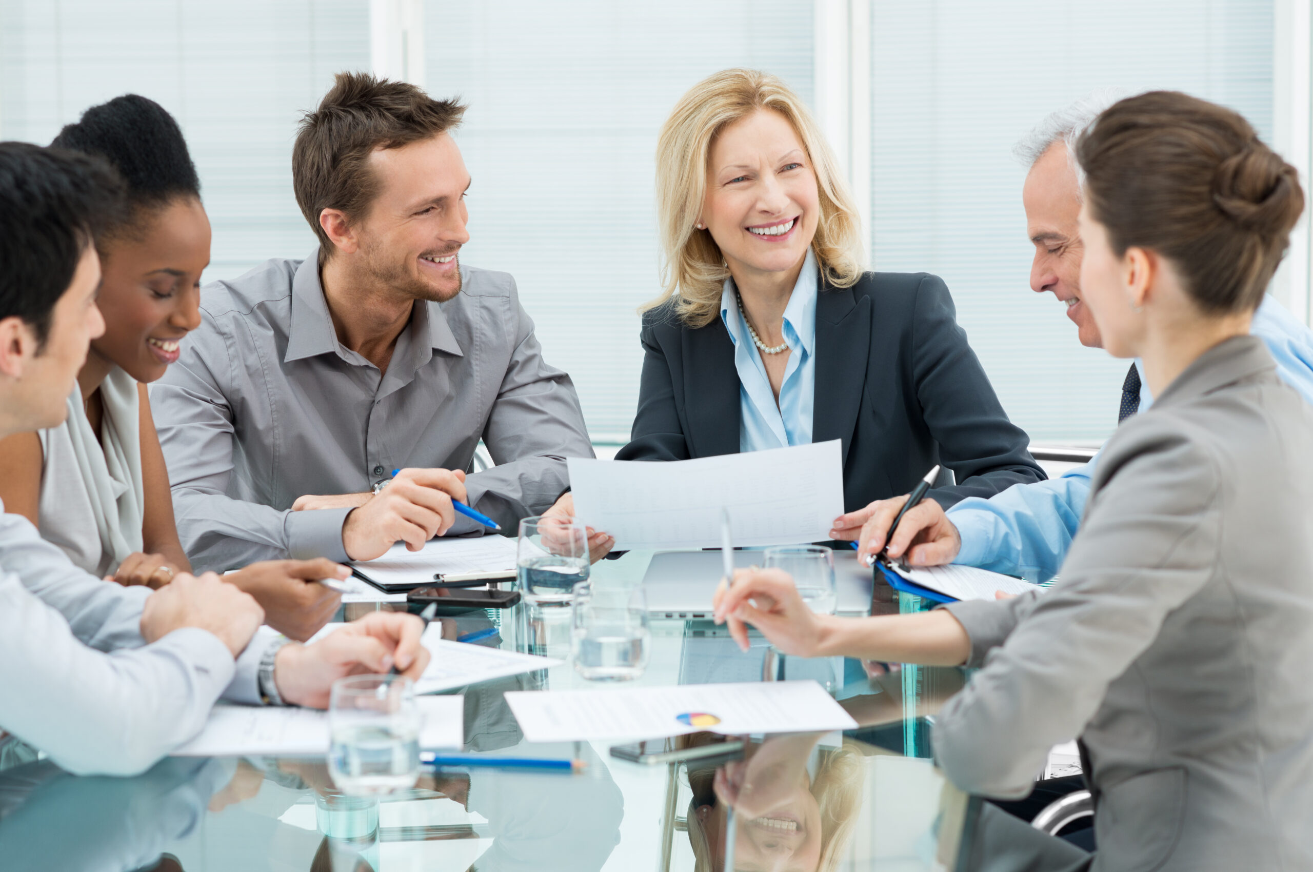 Group Of Happy Coworkers Discussing