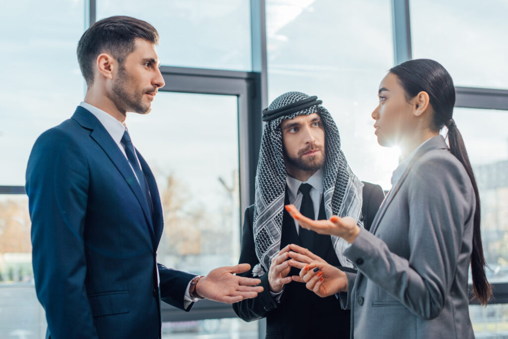 View of two men and a woman discussing