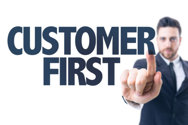 A man pointing at customer first text