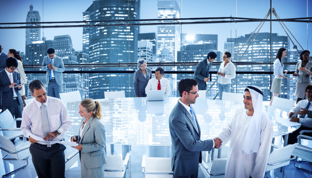 Business people handshaking in conference boardroom