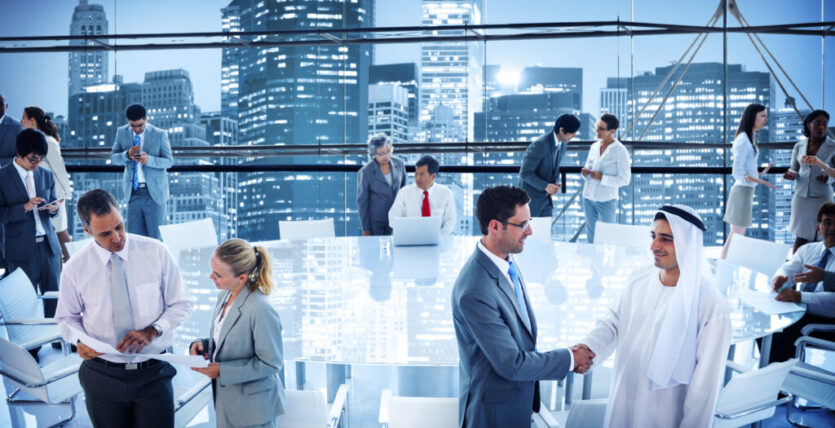 Business people handshaking in conference boardroom