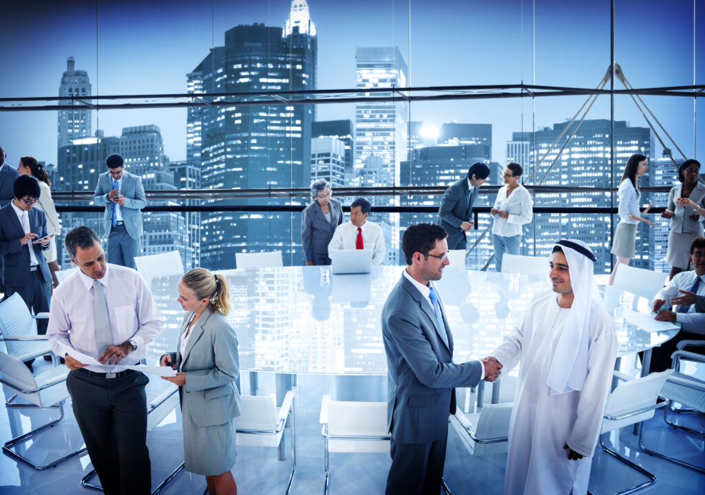 Business people handshaking in conference boardroom